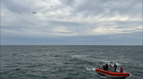 In this photo released by U.S. Coast Guard, crew members search by air and on the water for a Boston-bound air ambulance that vanished off the coast of Nantucket, Massachusetts, on Saturday, Oct. 3, 2026.