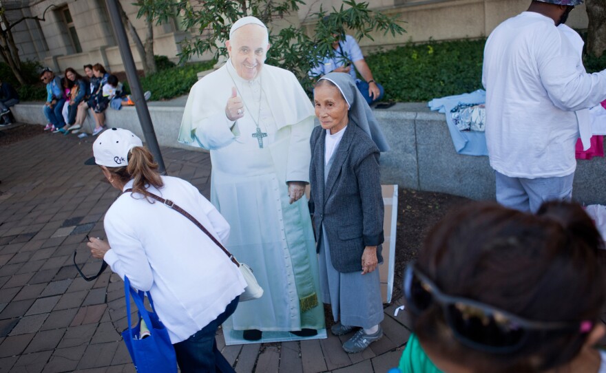 A cutout of Pope Francis attracted people who wanted their picture taken with the pontiff.
