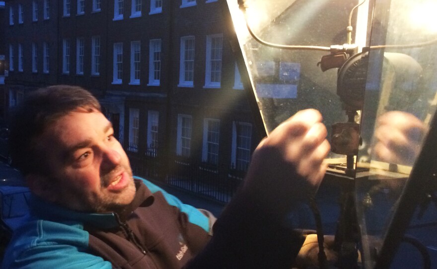 Garry Usher oversees the five lamplighters employed by British Gas. Each night, members of his crew wind up, by hand, the clocks that control when the lamps, like this one at St. John's church in Smith Square, turn on and off.
