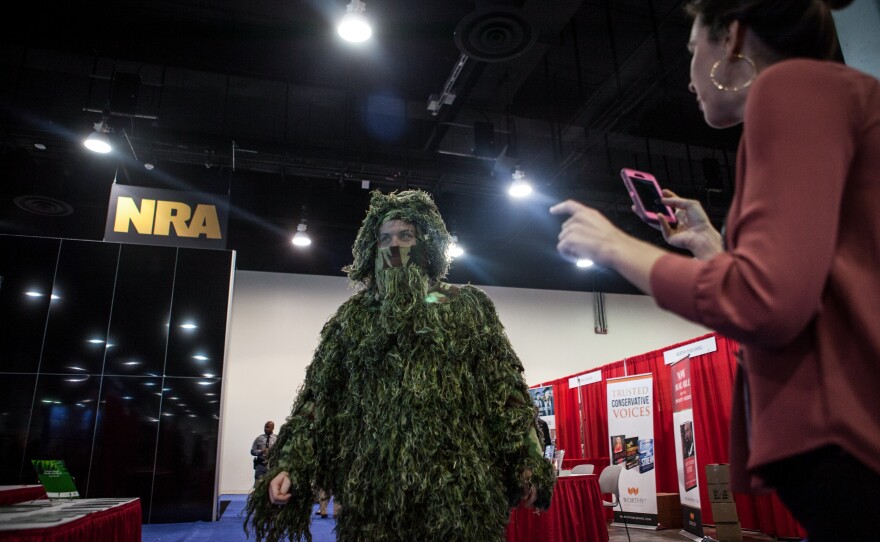 Geoff Krumwiede of Regnery Publishing dressed as a "swamp monster" as he wandered the conference.