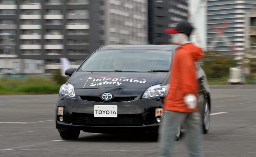 Toyota demonstrates its "pre-collision system," which uses automatic steering in addition to automatic braking to prevent collisions, in Tokyo in 2013. Different manufacturers use different names for systems like this, which can be confusing, a AAA report found.