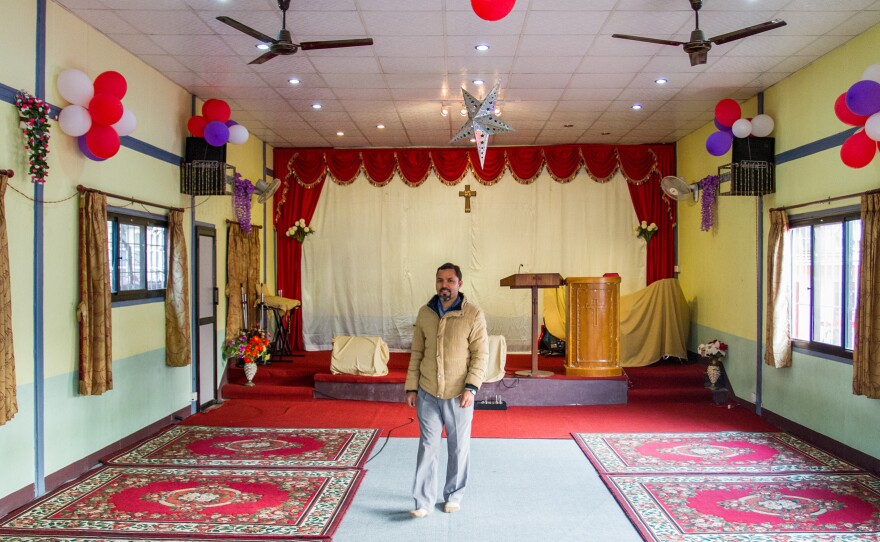 Tej Rokka is a Nepali pastor who works with the evangelical group Climbing for Christ. He's standing inside Savior Alone Redeems Asians church, in Kathmandu, where he preaches.