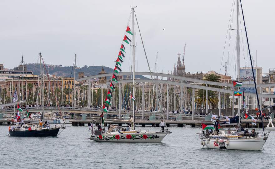 Boats carrying activists and humanitarian aid for Palestinians in Gaza reposition in the port during a symbolic send-off as part of the Global Sumud Flotilla, in Barcelona, Spain, Sunday, April 12, 2026.