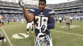 San Diego Chargers strong safety Marcus Gilchrist (38) celebrates on the field after the Chargers defeated the St. Louis Rams 27-24 in an NFL football game in San Diego, Nov. 23, 2014. 