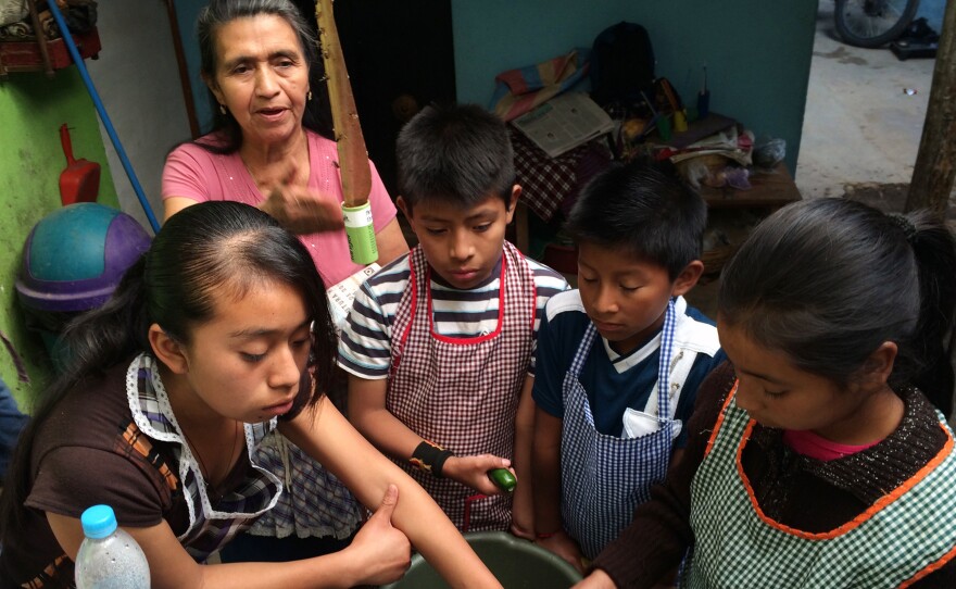 Children learn to cook at Prodesenh, a community center in San Mateo Milpas Altas, Guatemala.