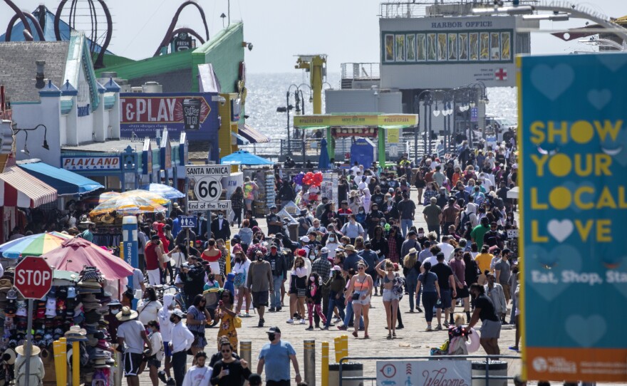 The Santa Monica Pier welcomed outdoor visitors on Monday as Los Angeles County entered the less restrictive orange tier. The following day, California Gov. Gavin Newsom announced a target statewide reopening date of June 15, provided certain public health criteria are met.