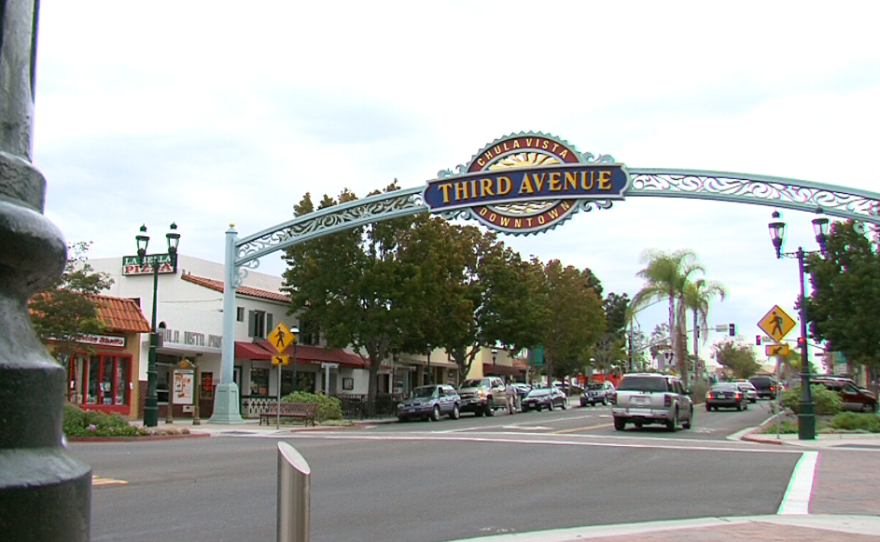 Cars pass under the Third Avenue sign in downtown Chula Vista, Oct. 7, 2014. 