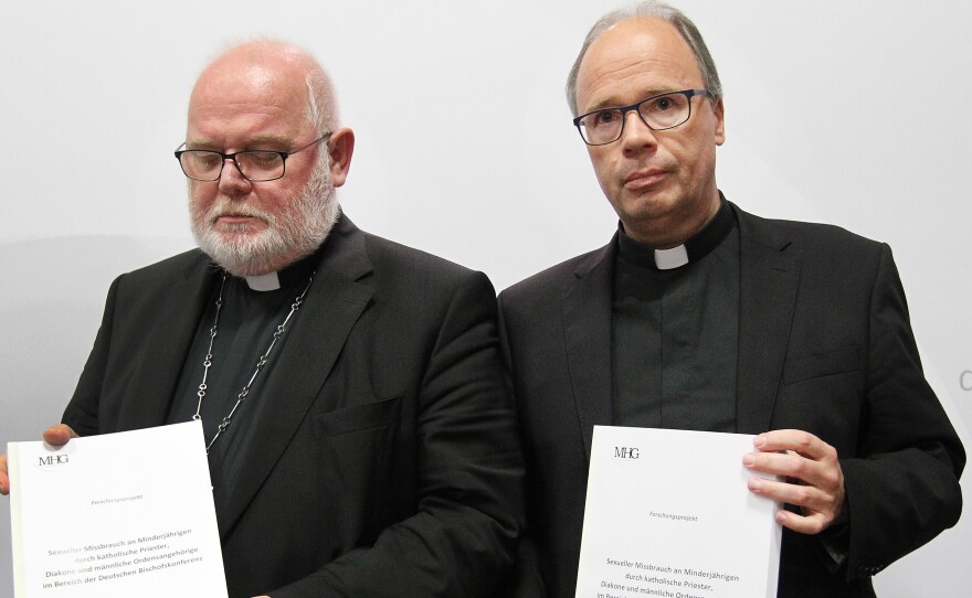 Cardinal Reinhard Marx and Bishop Stephan Ackermann present the results of the study on sexual abuse of minors by Germany's Catholic priests and clerics on Tuesday in Fulda, Germany.