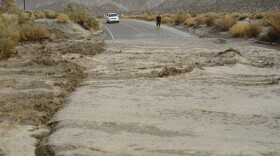 Mud and water flow across Highway 78 in San Diego County.