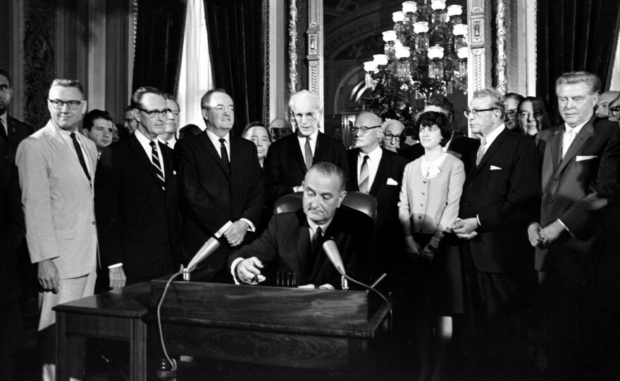 President Lyndon B. Johnson signs the Voting Rights Act into law on Aug. 6, 1965.