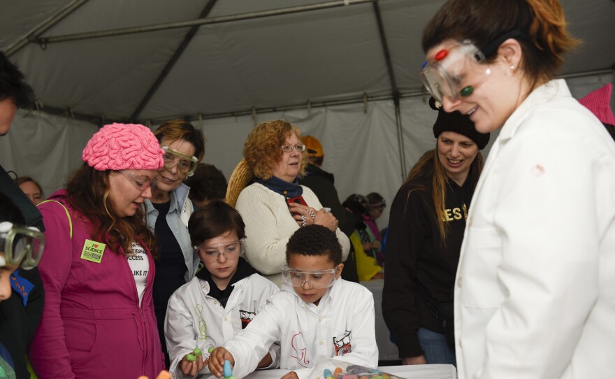 Abralyn Weidow (left), Geyo and Stirling explore "Magic Nuudles" at the Kids Zone during the March for Science event in Washington, D.C.