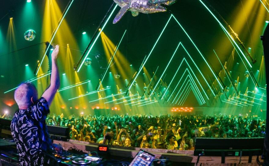 Fatboy Slim performs onstage at the Coachella Valley Music and Arts Festival in Indio, Calif., on April 24. Festivals and other gatherings are coming back despite the lingering COVID-19 pandemic.