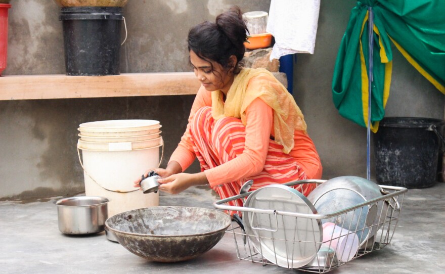 Rana, here at her family's home, has been trying to study remotely, but she says her family loaded her with chores expected of a girl in her community. "There's all kinds of housework I have to do," she says.