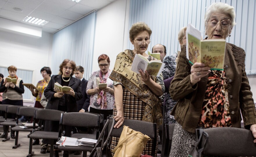 Jehovah's Witnesses sing songs during a meeting in Rostov-on-Don, Russia, in November 2015. The country's top prosecutor is threatening a nationwide ban for alleged "extremism."