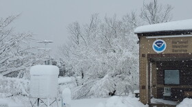 A fast-moving storm dropped over a foot of snow in some areas of New York, including in Binghamton where the National Weather Service reported a record snowfall.