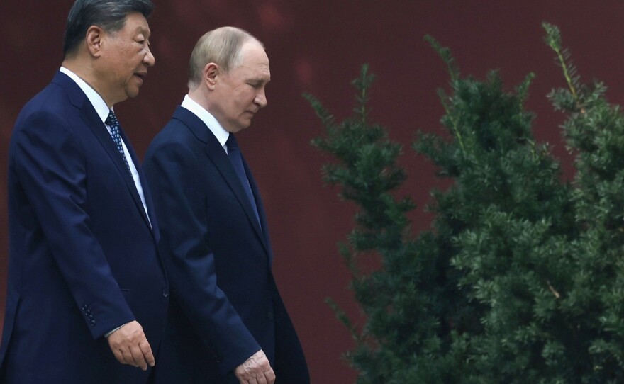 FILE - Russian President Vladimir Putin, right, speaks with Chinese President Xi Jinping during a walk at the Zhongnanhai leadership compound in Beijing, China, Sept. 2, 2025.