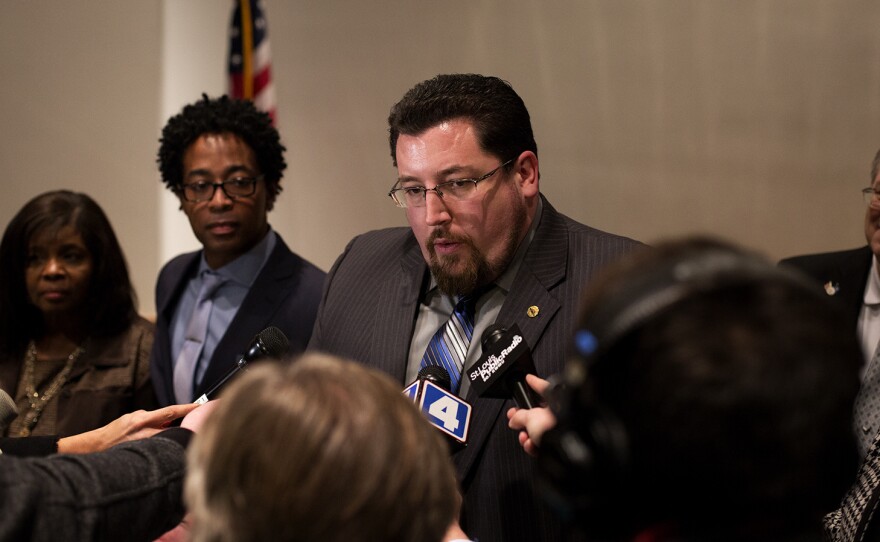 Ferguson Mayor James Knowles III talks to reporters after a 2016 city council hearing. Knowles is seeking a third term leading Ferguson, where a police officer shot and killed 18-year-old Michael Brown in 2014.