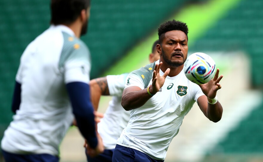 Henry Speight of Australia receives a pass during the Wallabies' practice ahead of Saturday's World Cup final against New Zealand at Twickenham Stadium in London.