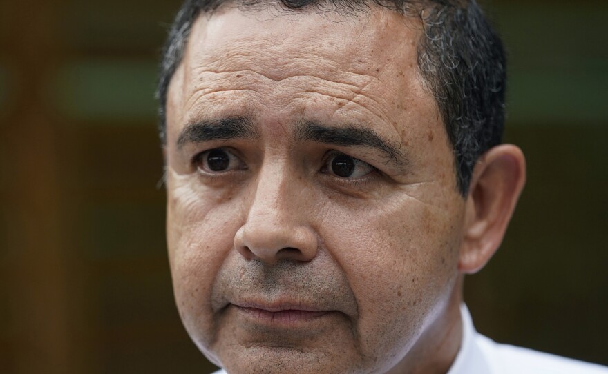 U.S. Rep. Henry Cuellar, D-Texas, is shown talking to a member of the media during a campaign event in San Antonio, May 4, 2022.