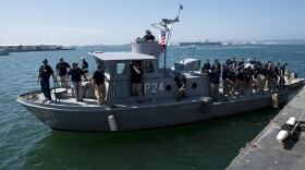 Navy Vietnam veterans arrive aboard a retired P24 swift boat during an induction ceremony for the boat into the Maritime Museum of San Diego. The P24 will now reside among the historic fleet of vessels at the Maritime Museum of San Diego. 