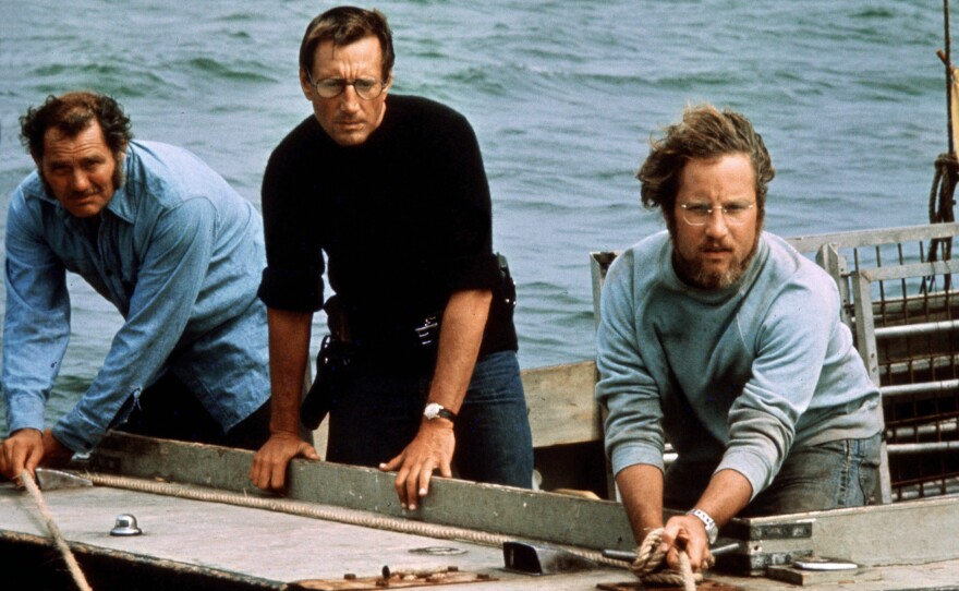 Robert Shaw (from left), Roy Scheider and Richard Dreyfuss play a shark hunter, a police chief and a marine biologist in 1975's <em>Jaws</em>.