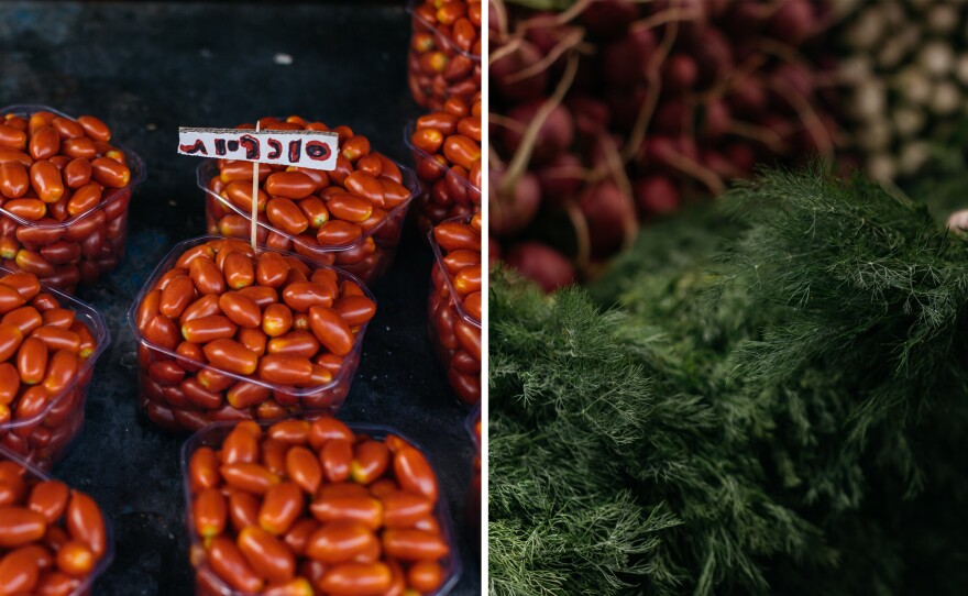 Tomatoes and dill at Tel Aviv's Carmel Market on Friday morning, Sept. 1, 2023.