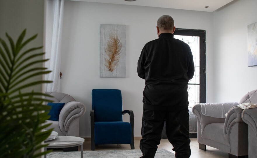 Baker Rafe' Rummaneh prays in his home outside Ramallah in the occupied West Bank on April 9.