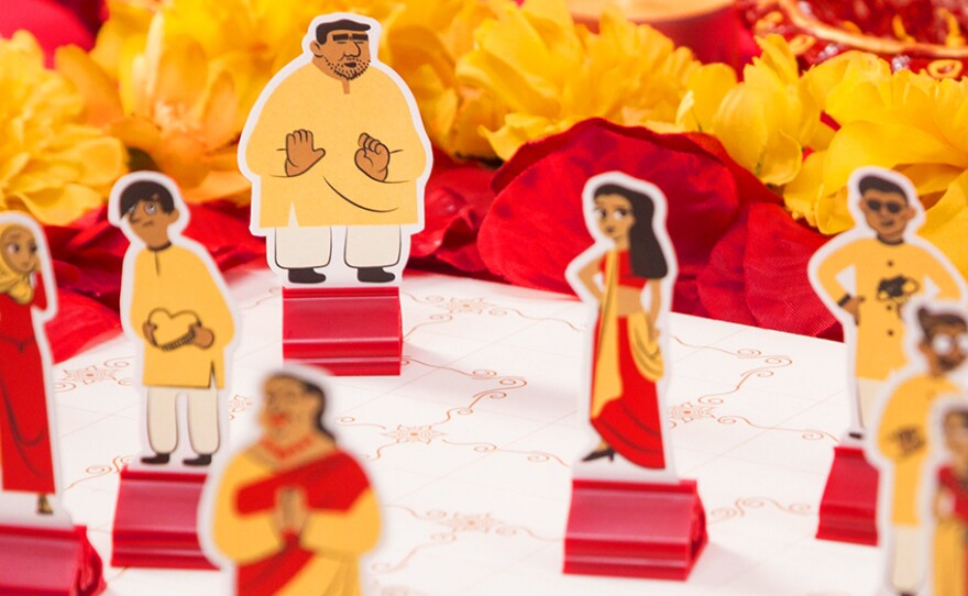 The point of the game is avoid the matchmaker (the figurine with hands clasped at the front of the photograph).