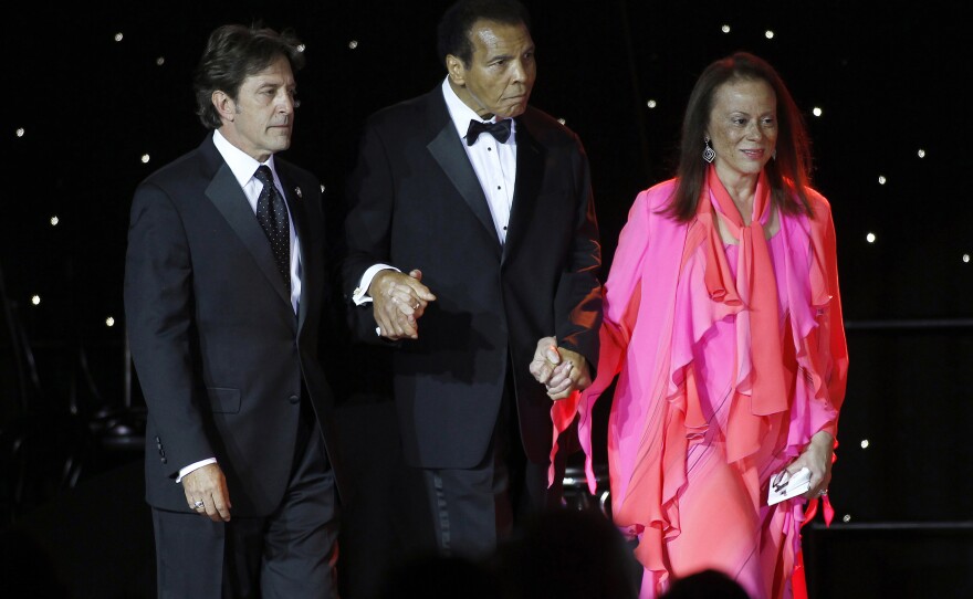 Ali is escorted onstage by his wife, Lonnie, and a personal assistant during The Muhammad Ali Celebrity Fight Night Awards XIX in Phoenix on March 23, 2013. The awards are given out to celebrities who embody the qualities of Ali and his fight to find a cure for Parkinson's disease.