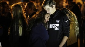 Hannah Schooping-Gutierrez, center, a student at Saugus High School, is comforted by her boyfriend Declan Sheridan, at right, a student at nearby Valencia High School during a vigil at Central Park in the aftermath of a shooting at Saugus Thursday, Nov. 14, 2019, in Santa Clarita, Calif. 