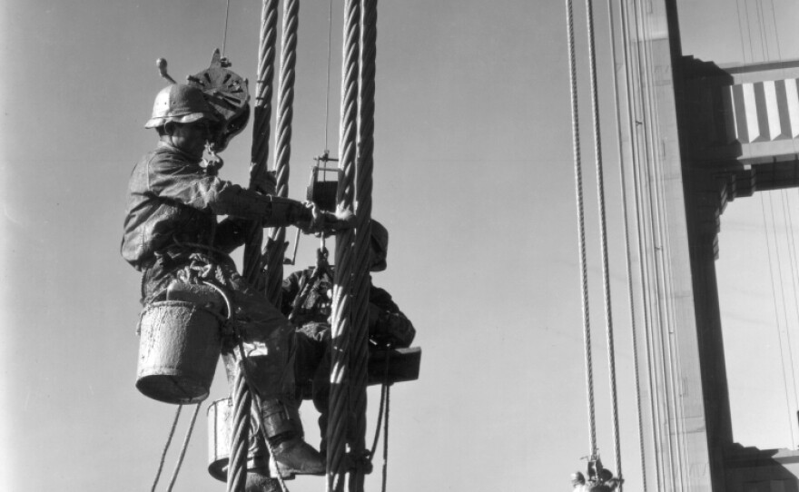 A painter at work in 1937, the year the Golden Gate Bridge opened. It was the longest suspension bridge in the world at the time; painters had to cover more than 10 million square feet of steel.