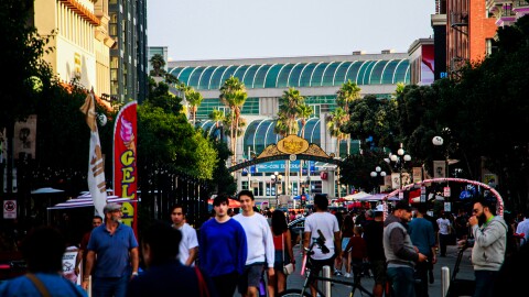 People walking the streets of the Gaslamp Quarter at 5:20pm, as Comic-Con closes its doors, Sunday, July 23, 2023. The international convention might be over, but the spirit of the event has not left the streets, animating each corner with cosplay displays and other activations still in place.