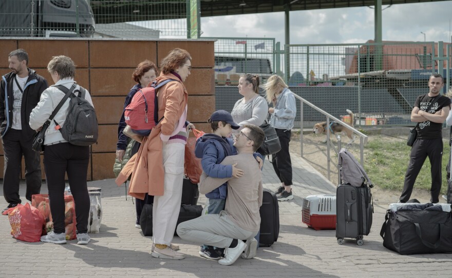 A family says their goodbyes to those returning to Ukraine.