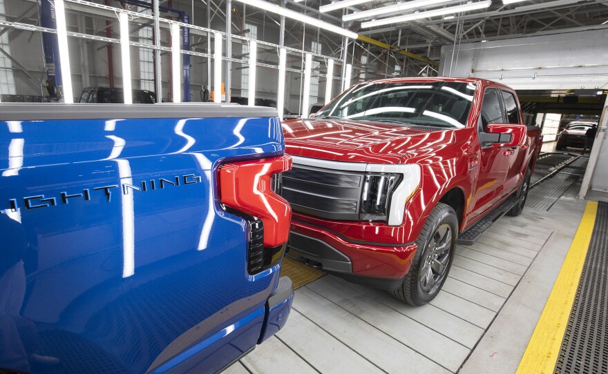 Ford F-150 Lightning pickup trucks are shown at the Ford Rouge Electric Vehicle Center in Dearborn, Michigan, on April 26, 2022. The Lightning should still qualify for the full $7,500 tax credit, but it also depends on other criteria including the sticker price of the vehicle and the buyer's income.