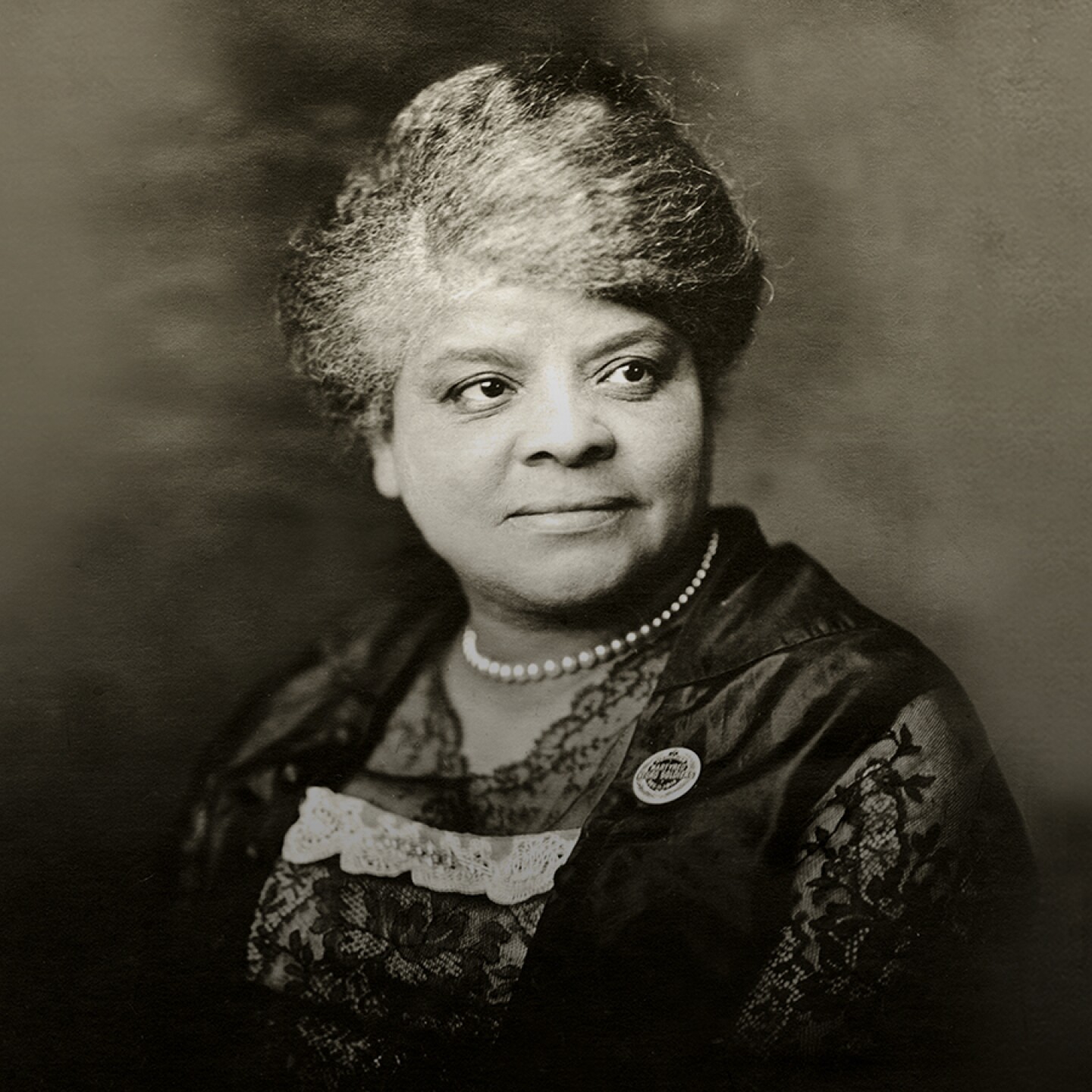 Ida B. Wells wearing a button she created to publicize a memorial service for African-American combatants court-martialed and hanged in Houston, Tex., in the summer of 1917. The button reads “In Memoriam Martyred Negro Soldiers Dec. 11, 1917."
