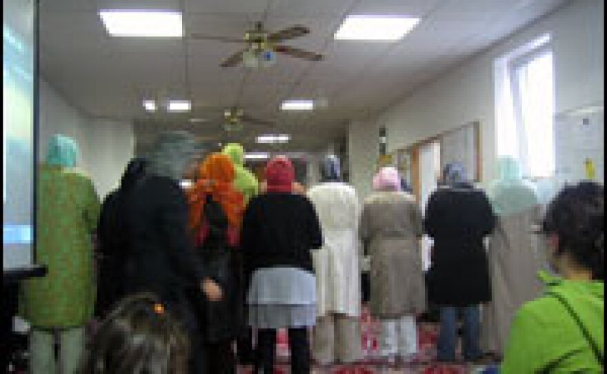 On Friday evening, veiled women gather in their section of Berlin's Bilal prayer hall.