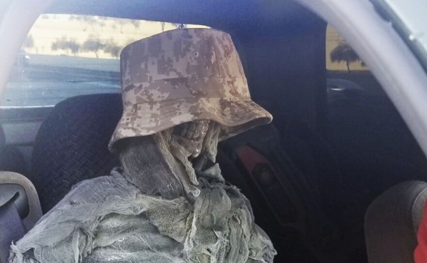This Thursday, Jan. 23, 2020, photo provided by the Arizona Department of Public Safety shows a dummy skeleton found after a state trooper traffic stop of a 62-year-old man for an HOV lane violation in Phoenix. (Arizona Department of Public Safety via AP)