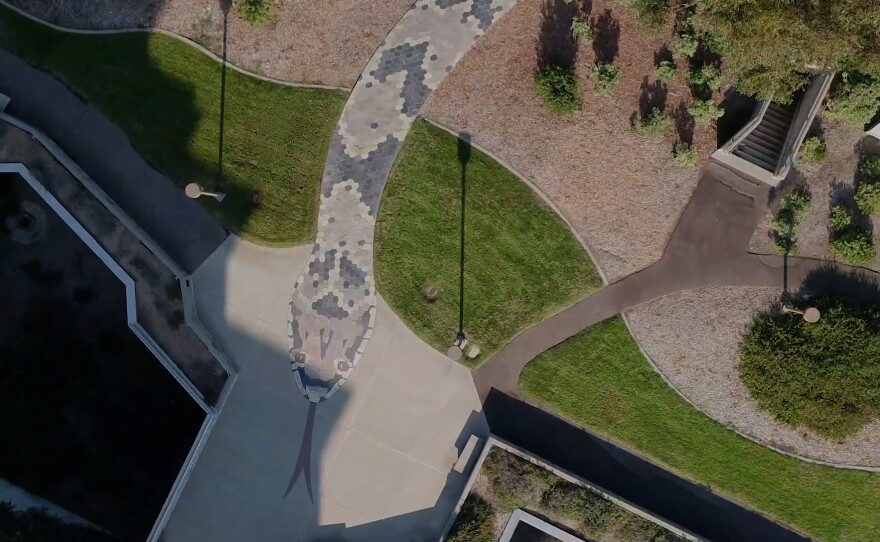 Alexis Smith's Snake Path in the Stuart Collection consists of a winding 560-foot-long, 10-foot-wide footpath in the form of a serpent, whose individual scales are hexagonal pieces of colored slate, and whose head is inlaid in the approach to the Geisel Library.