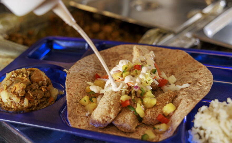 Fish tacos served with a side of cilantro lime rice and lentil stew were offered to students.