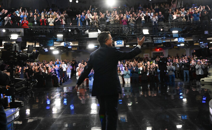 Host Stephen Colbert receives a standing ovation during Thursday night's Late Show finale.