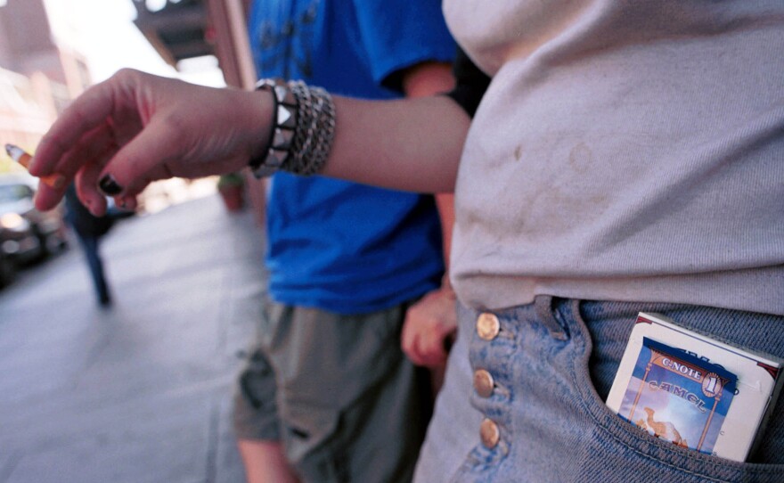 A teenager finishes her cigarette in Boston's Back Bay neighborhood.