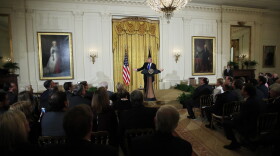 President Donald Trump speaks to a gathering of mayors in the East Room of the White House in Washington, Wednesday, Jan. 24, 2018.