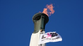 The Olympic cauldron is lit at the Los Angeles Memorial Coliseum in January ahead of ticket registration. The IOC's new policy takes effect for the 2028 Summer Games.