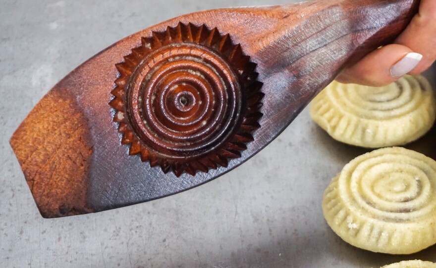 Traditionally carved wooden molds are used to give shape and form to the maamoul cookies.