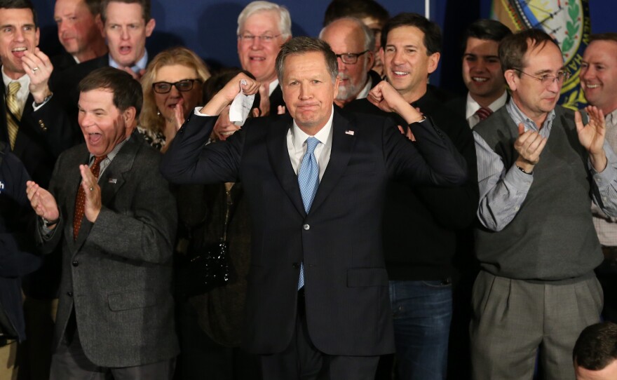 Republican presidential candidate John Kasich arrives onstage at a campaign gathering with supporters after placing second in the New Hampshire Republican primary in Concord, N.H.