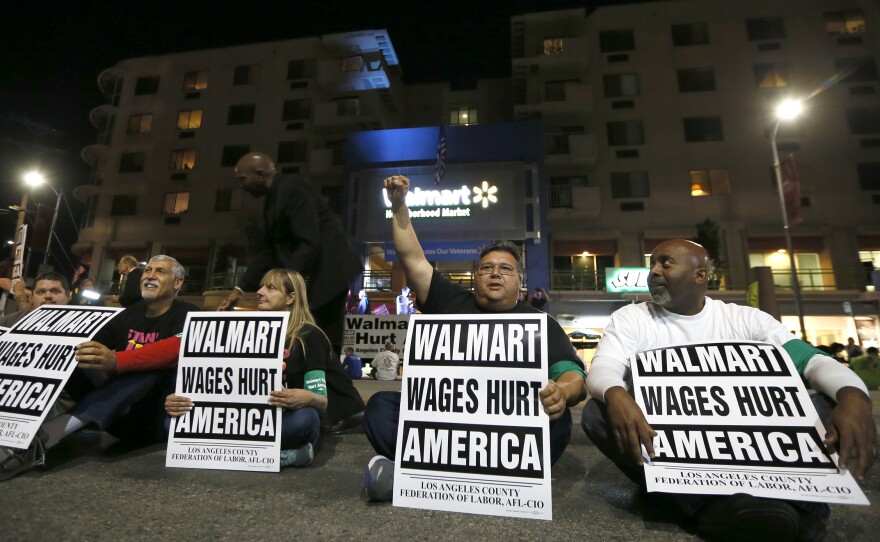 Dozens of people protest for better wages outside a Los Angeles Wal-Mart store on Nov. 7.