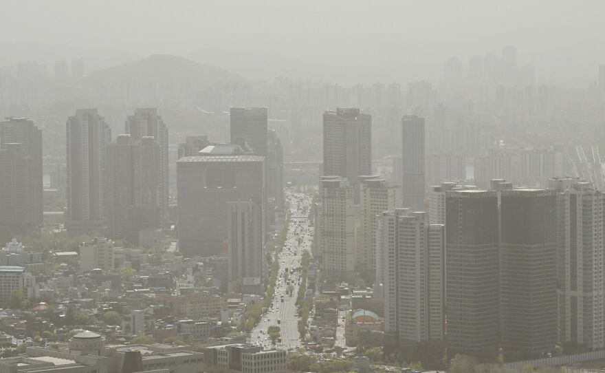 A general view showing buildings shrouded by polluted air in Seoul on April 12, 2023.
