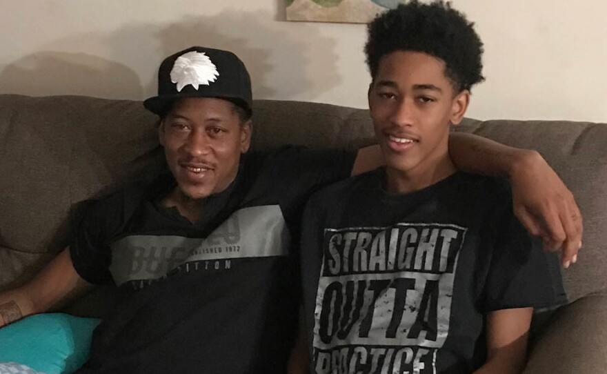 Albert Sykes, left, with his eldest son, Aidan, at home this week in Jackson, Miss.