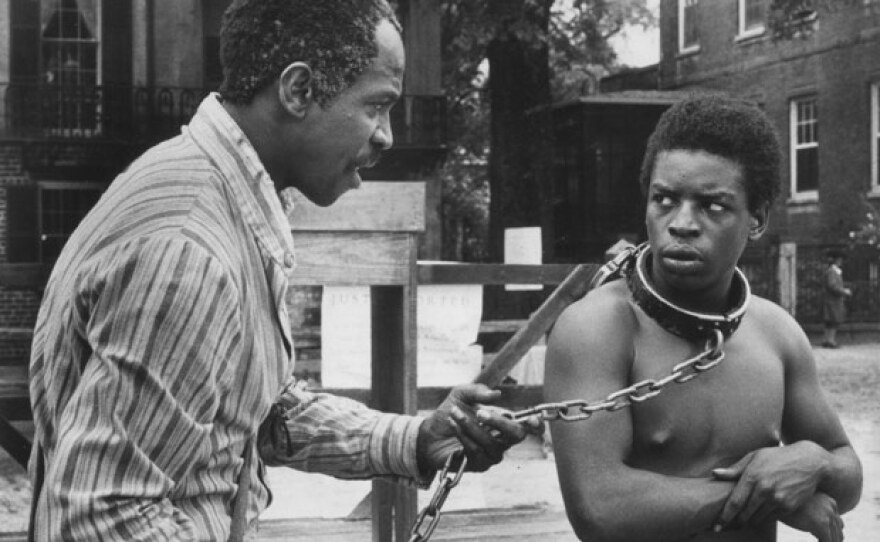 Fiddler (Louis Gossett Jr.) offers sage advice to Kunta Kinte (LeVar Burton) in the 1977 miniseries "Roots."