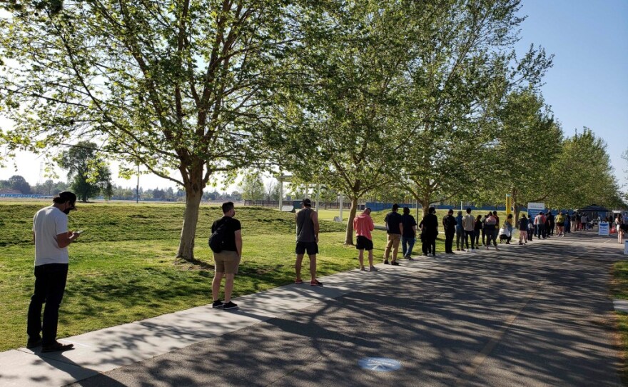 People line up for the Pfizer COVID-19 vaccine at CSU Bakersfield on April 7, 2021.